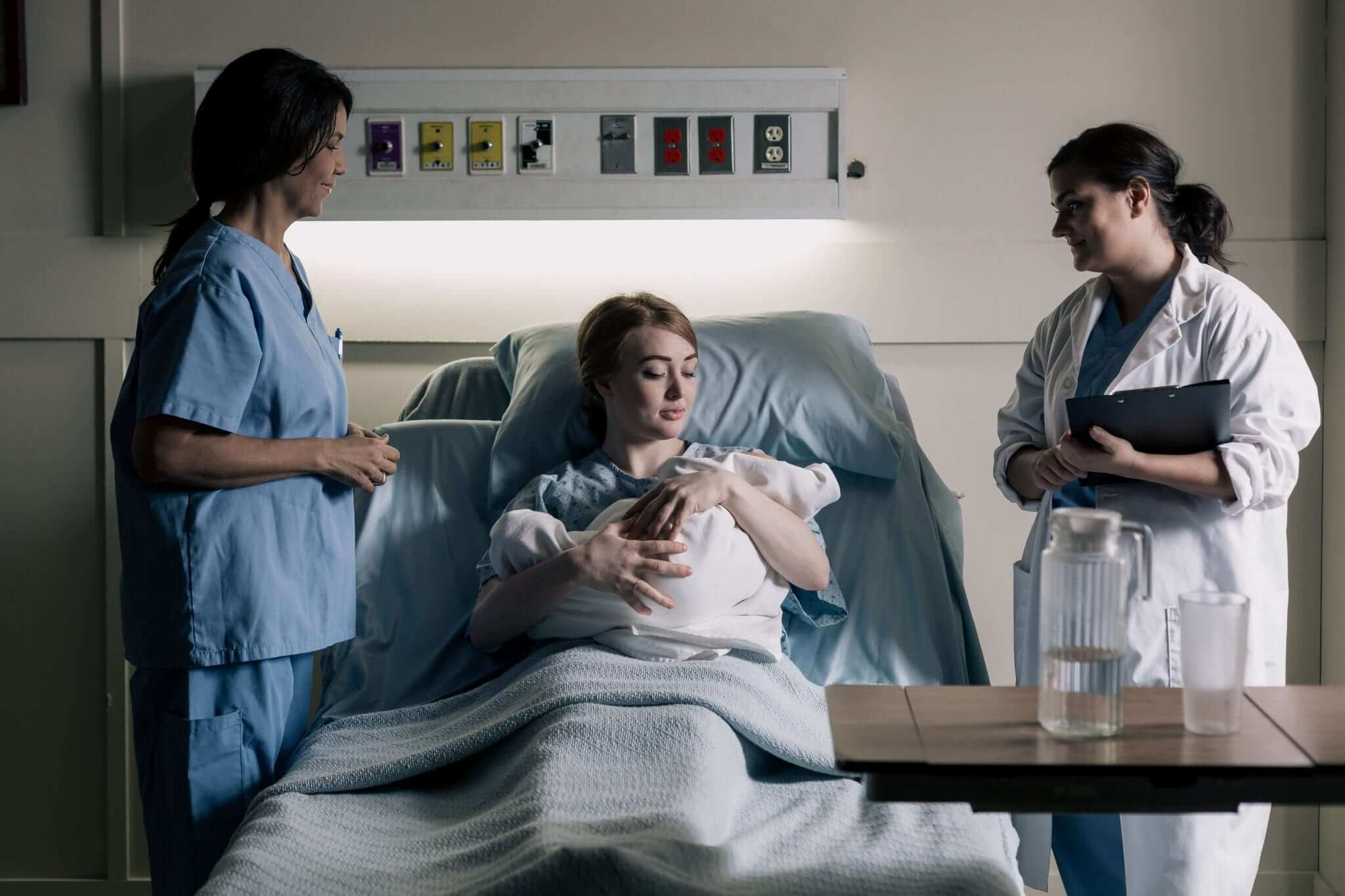 LVN and Doctor with Mother and Her Newborn Baby in the Hospital