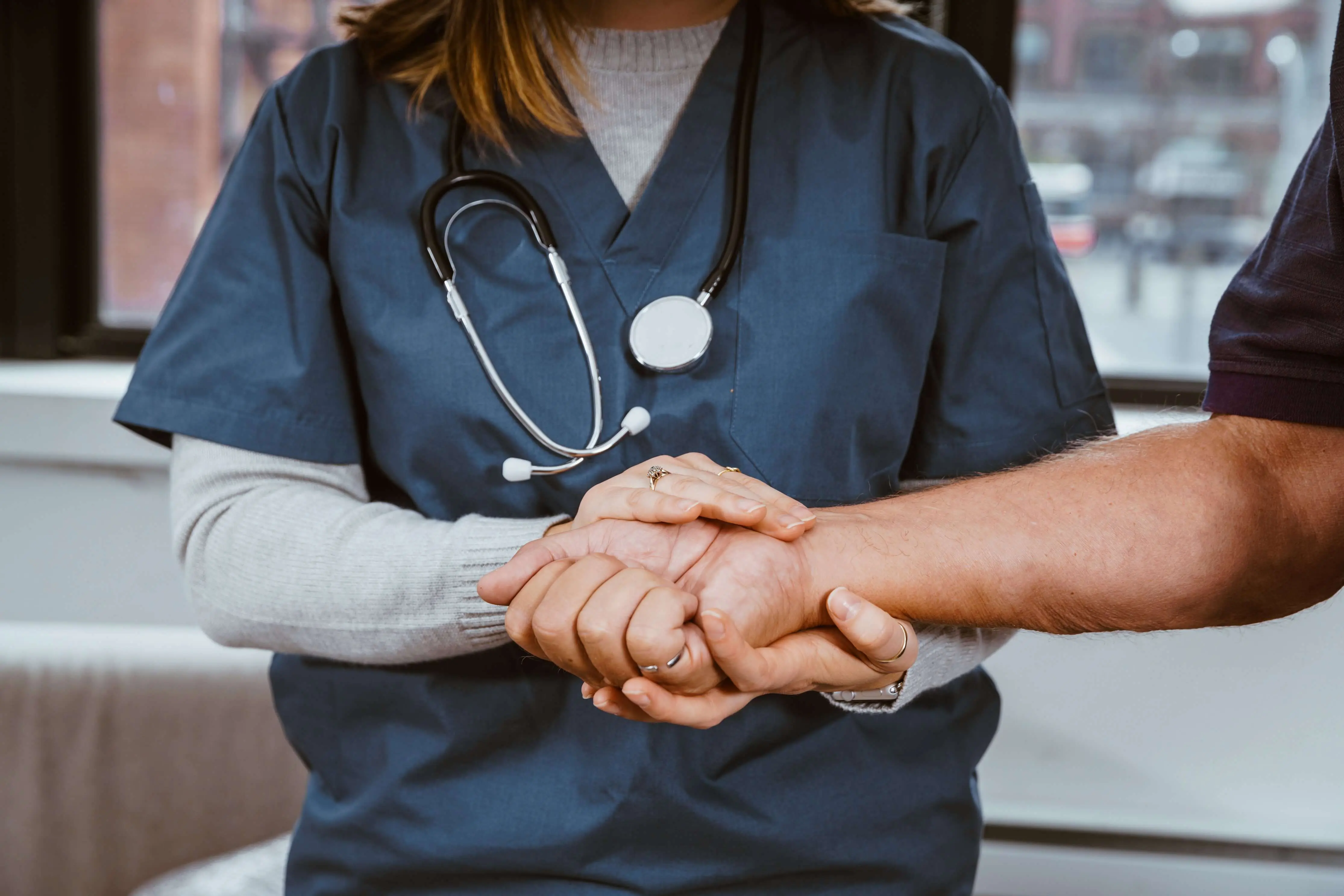 Not "Only" an LVN 1 Licensed Vocational Nurse (LVN) Holds Hand of Patient