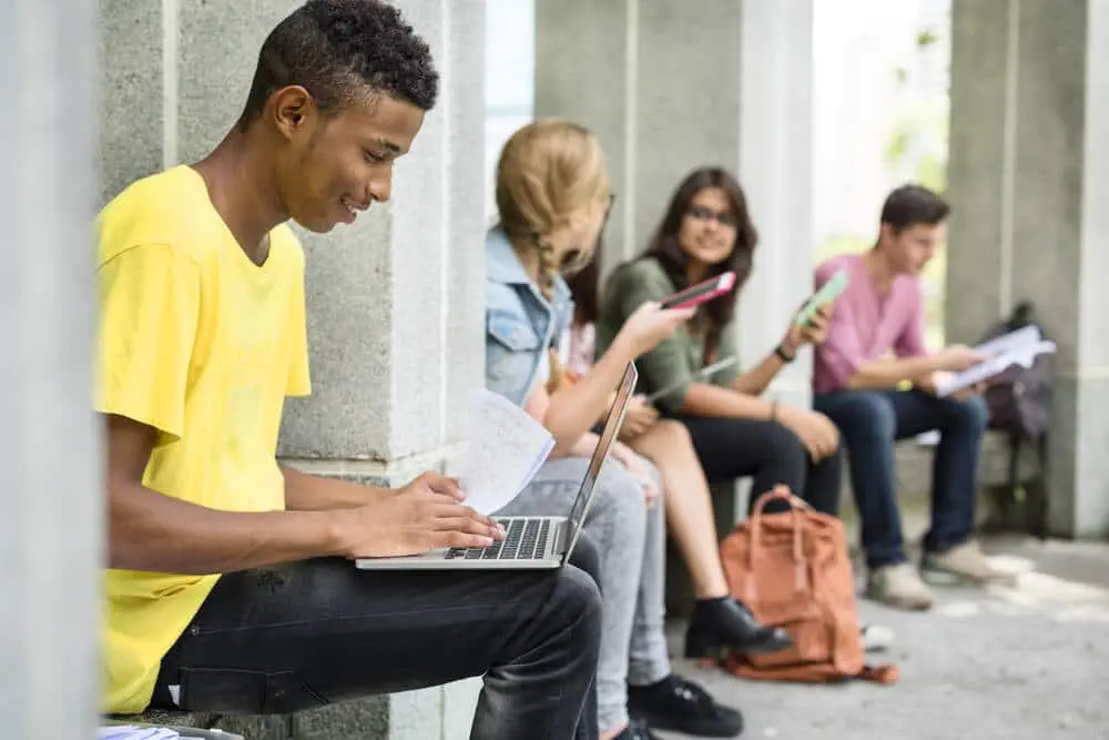 Prepare For Your College Campus Tour With These Five Practical Steps 1 Prepare For Your College Campus Tour Young Man Working on his Laptop