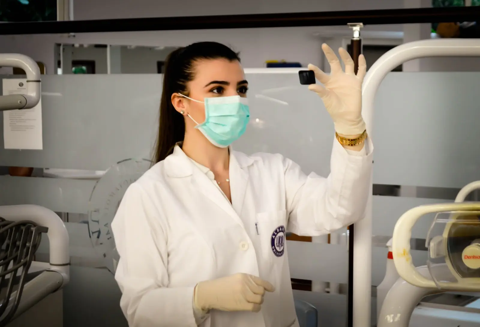 Am I Right for a Healthcare Career? Five Questions To Ask 1 Young healthcare technician wearing mask reviews patient's medical image